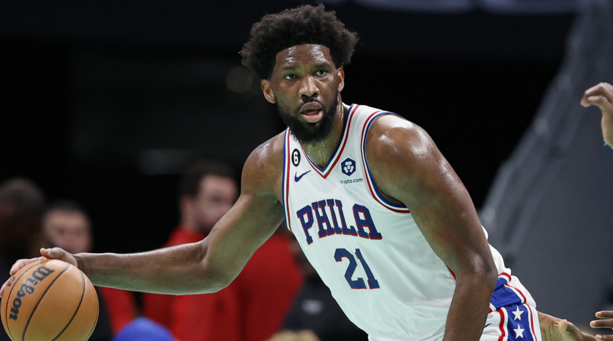 76ers center Joel Embiid looks to pass the ball