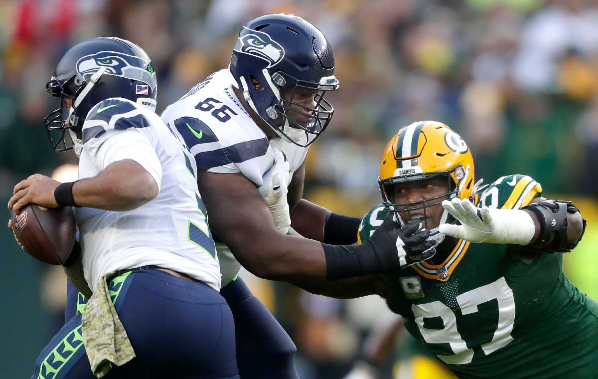 Seattle Seahawks guard Gabe Jackson (66) blocks Green Bay Packers nose tackle Kenny Clark (97) as he chases quarterback Russell Wilson (3) during their football game on Sunday November 14, 2021, at Lambeau Field in Green Bay, Wis. Wm. Glasheen USA TODAY NETWORK-Wisconsin Apc