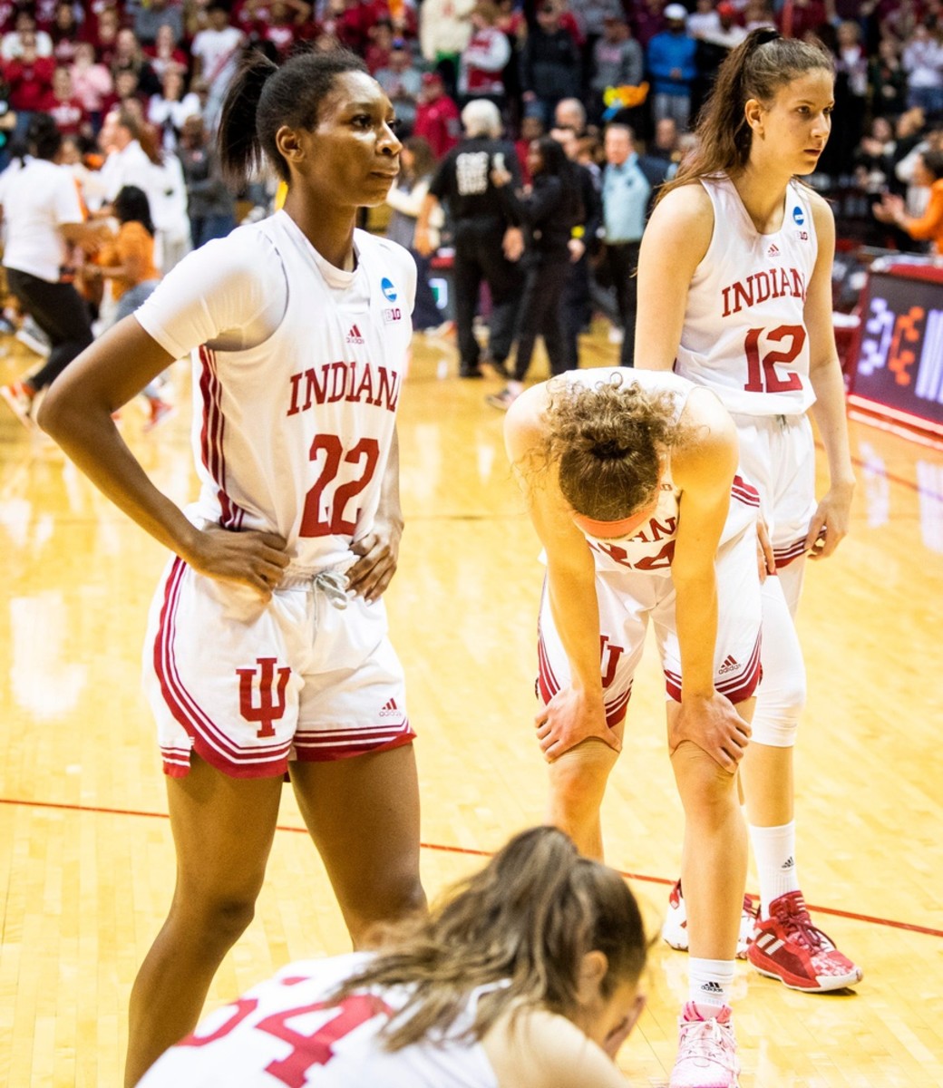 Indiana's Chloe Moore-McNeil (22), Mackenzie Holmes (54), Grace Berger (34) and Yarden Garzon (12) react to the loss after the second half of the NCAA Tournament second-round game between Indiana and Miami (FL) at Simon Skjodt Assembly Hall on Monday, March 20, 2023.