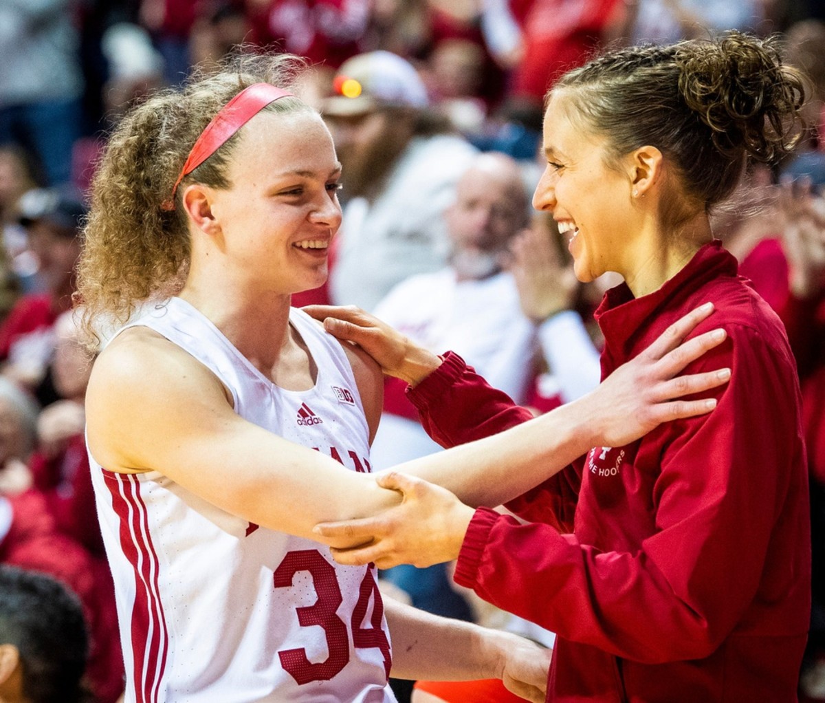 Indiana's Grace Berger (34) is welcomed off the floor by Team & Recruitment Coordinator Ali Patberg during the second half of the Indiana versus Purdue women's basketball game at Simon Skjodt Assembly Hall on Sunday, Feb. 19, 2023.