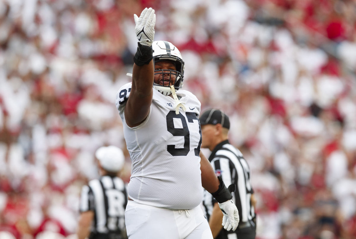 Penn State Nittany Lions defensive tackle PJ Mustipher (97) celebrates following a turnover during the second quarter against the Wisconsin Badgers at Camp Randall Stadium.