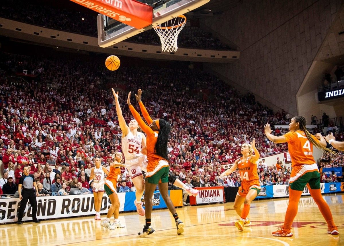 Indiana's Mackenzie Holmes (54) shoots over Miami (FL)'s Lola Pendande (21) during the second half of the NCAA Tournament Second Round game between Indiana and Miami (FL) at Simon Skjodt Assembly Hall on Monday, March 20, 2023.