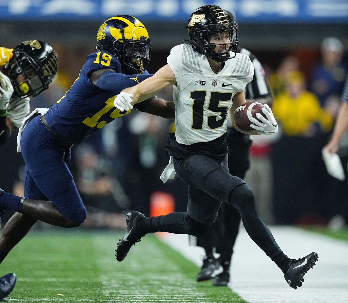 Purdue Boilermakers wide receiver Charlie Jones (15) rushes the ball during the Big Ten football championship on Saturday, Dec. 3, 2022 at Lucas Oil Stadium in Indianapolis. Michigan Wolverines lead at the half against the Purdue Boilermakers, 14-13. Ncaa Football Big Ten Championship Football Game Purdue Boilermakers At Michigan Wolverines