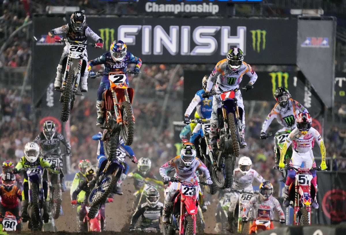 racers at the end of a supercross race in a crowd