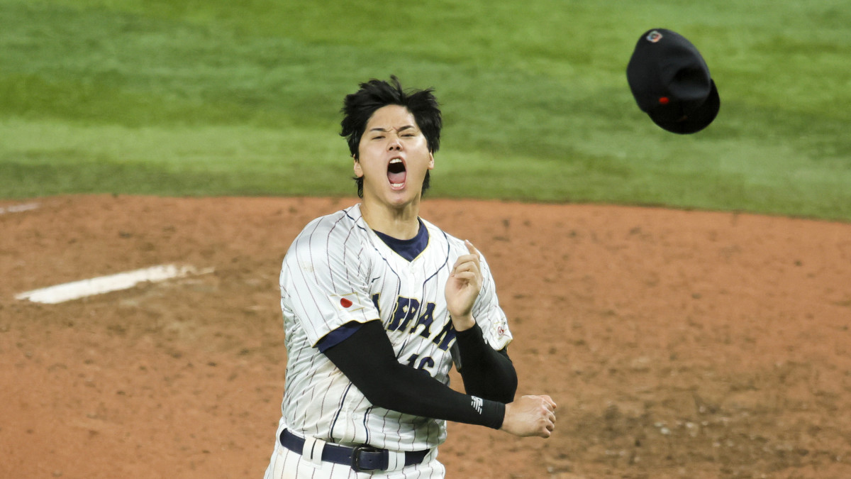 Shohei Ohtani celebrates after striking out Mike Trout
