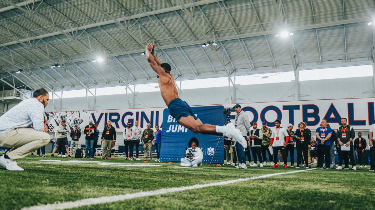 Darrius Bratton performs the broad jump drill at the 2023 Virginia Football Pro Day at the George Welsh Indoor Practice Facility.