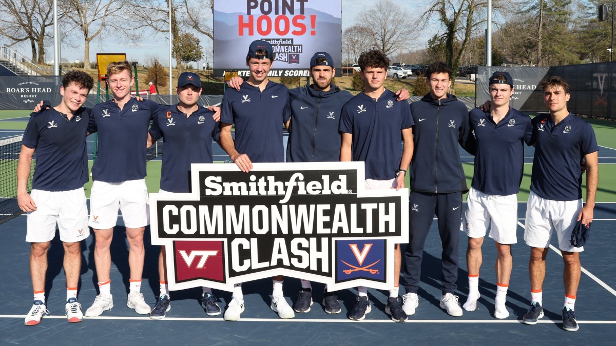 The Virginia men's tennis team poses after defeating Virginia Tech at Boar's Head Sports Club.