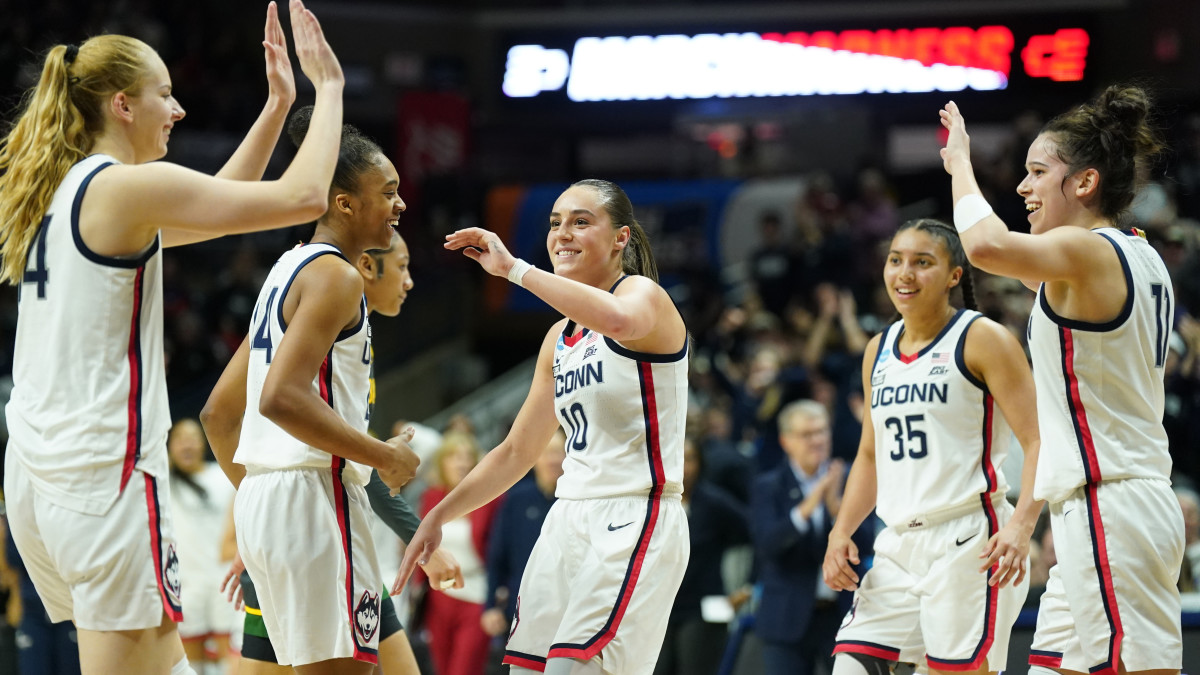 The UConn Huskies celebrate during the final seconds of the game against the Baylor Lady Bears.