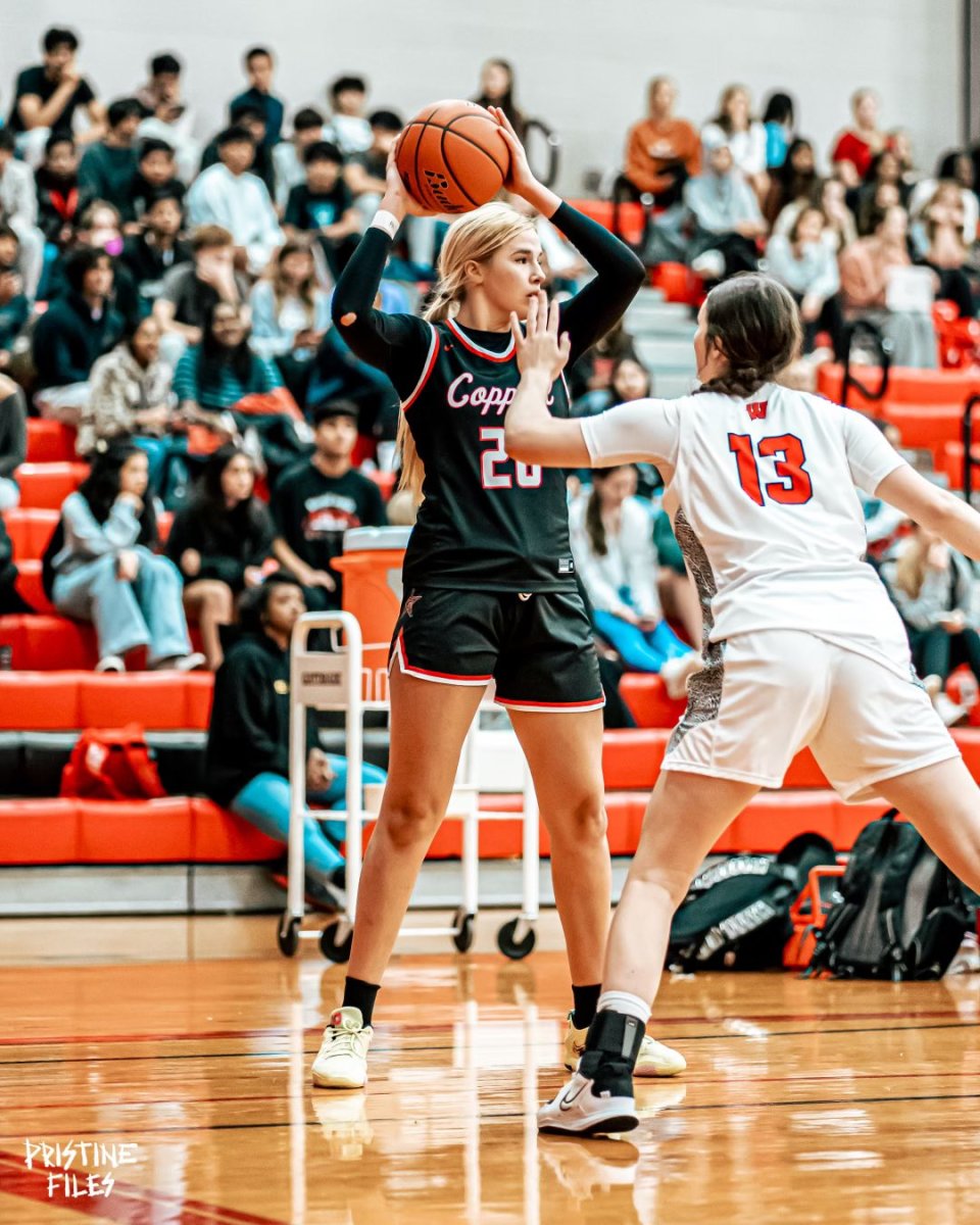 Coppell High School's Julianna LaMendola looks for passing options.
