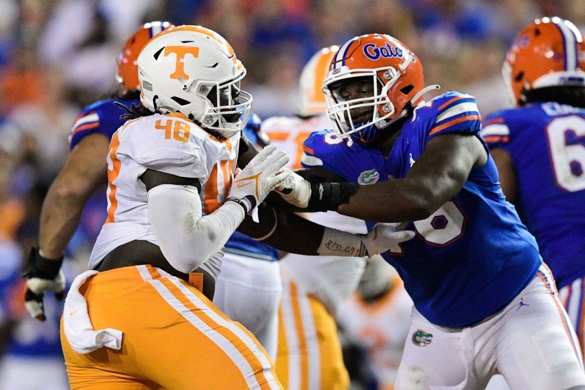 Tennessee placekicker Chase McGrath (40) and Florida offensive lineman Richard Gouraige (76) defend against one another during a game at Ben Hill Griffin Stadium in Gainesville, Fla. on Saturday, Sept. 25, 2021. Kns Tennessee Florida Football