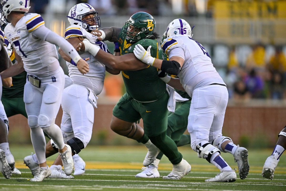 Baylor Bears defensive lineman Siaki Ika (62) is double teamed by Albany offensive linemen Kevin Singer (75) and Kobe Thomas (70). Mandatory Credit: Jerome Miron-USA TODAY Sports