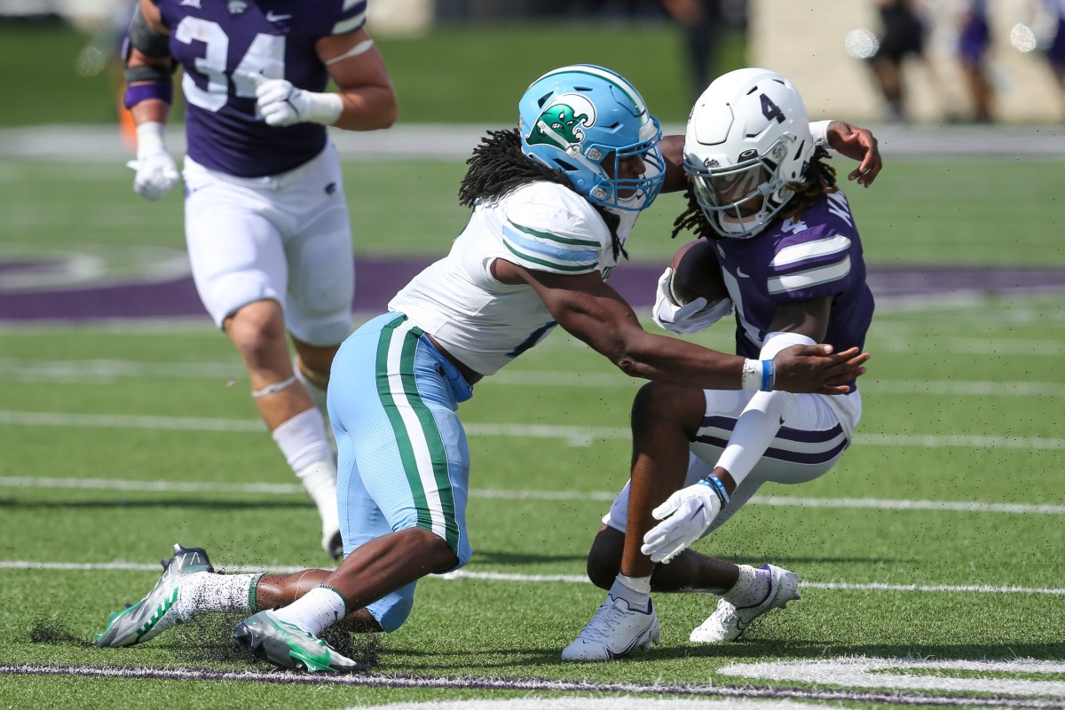 Kansas State Wildcats wide receiver Malik Knowles (4) is tackled by Tulane Green Wave linebacker Dorian Williams (2). Mandatory Credit: Scott Sewell-USA TODAY Sports