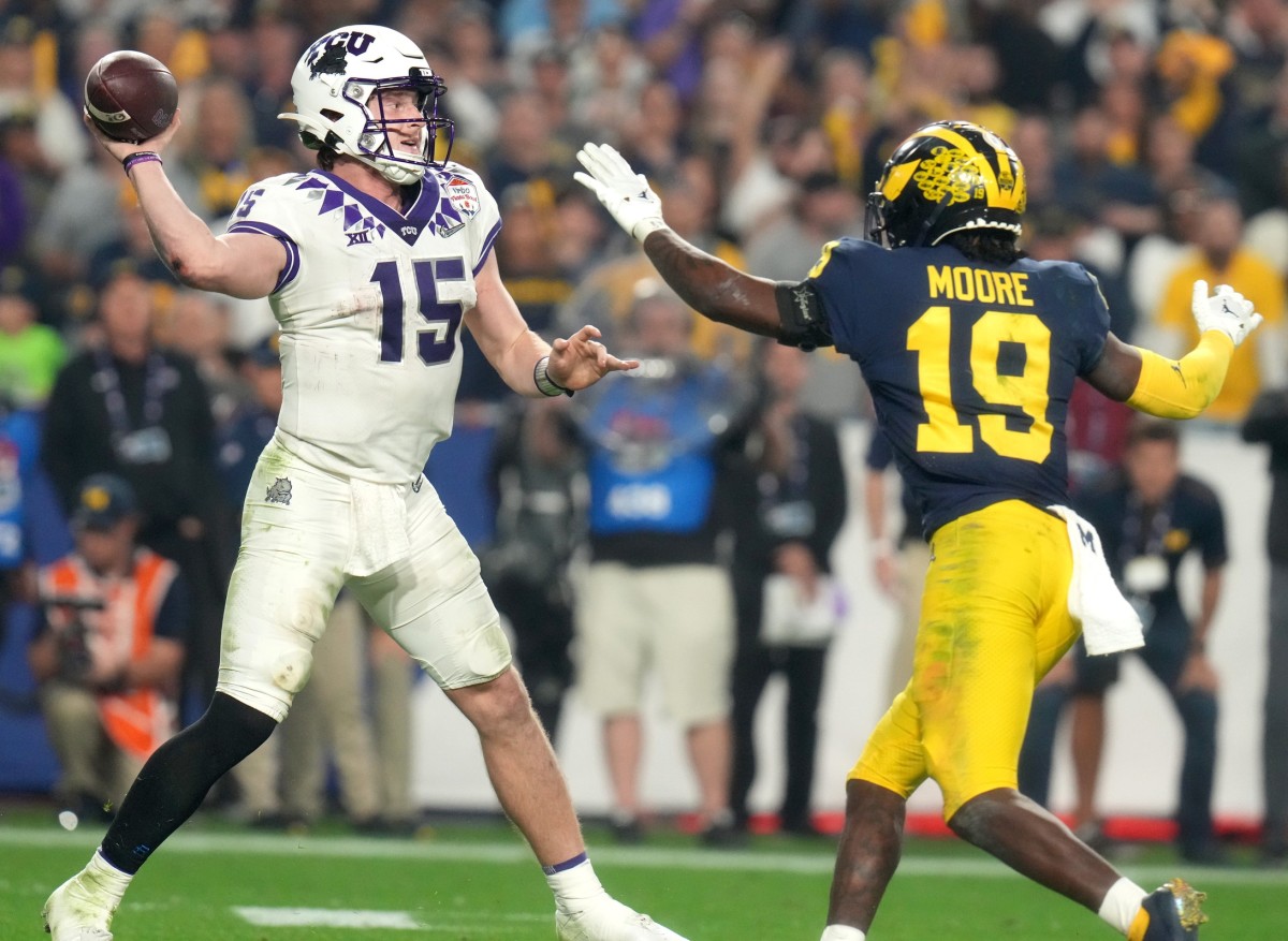 TCU Horned Frogs quarterback Max Duggan (15) throws against Michigan during the Vrbo Fiesta Bowl. Mandatory Credit: Joe Rondone-Arizona Republic