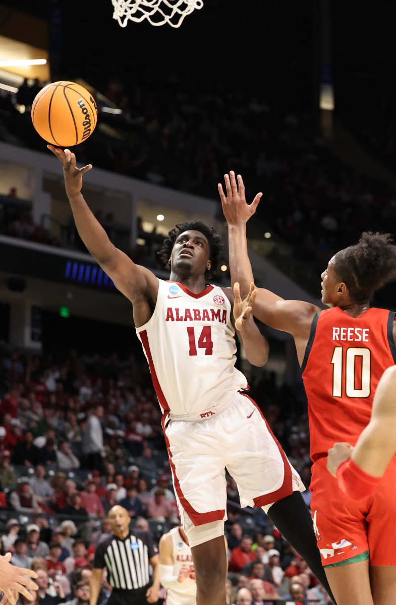 Charles Bediako goes into the paint for a layup for Alabama.