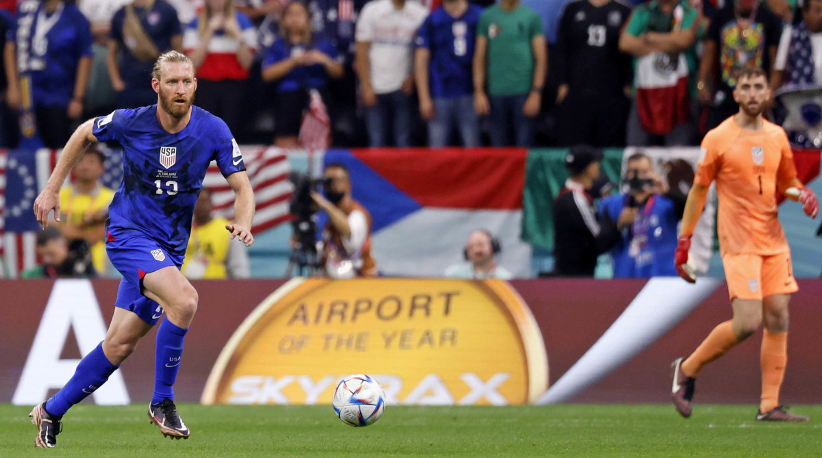 United States of America defender Tim Ream dribbles the ball against England.