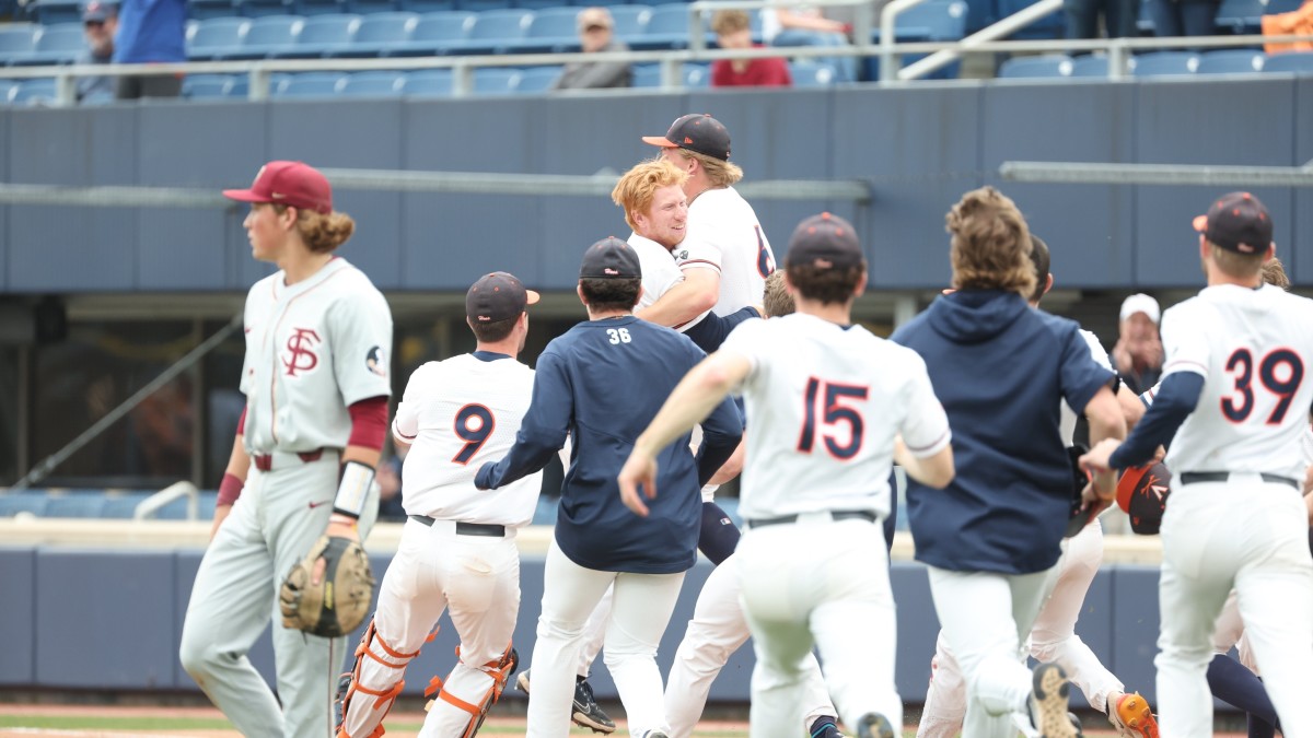 Chris Baker celebrates with his teammates after hitting the walk-off game-winner for the Virginia baseball team against Florida State at Disharoon Park.