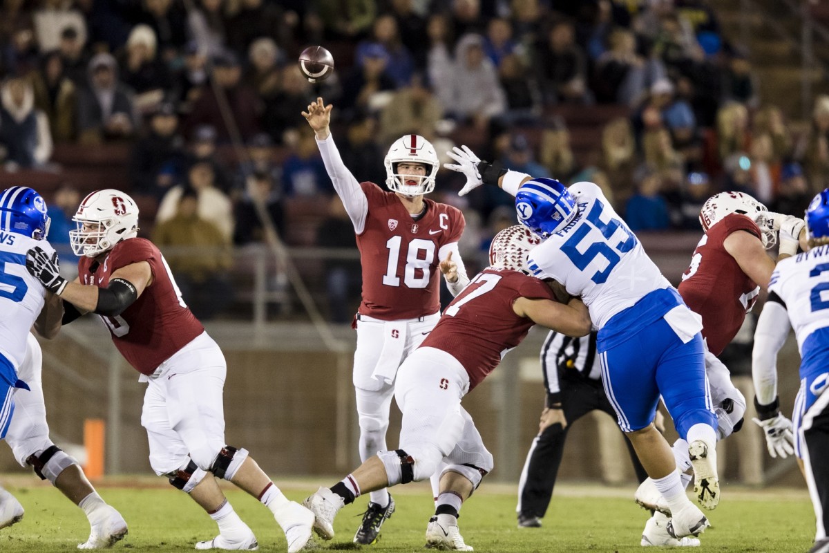 Nov 26, 2022; Stanford, California, USA; Stanford Cardinal quarterback Tanner McKee (18) throws a pass against the Brigham Young Cougars during the first half at Stanford Stadium. Mandatory Credit: John Hefti-USA TODAY Sports