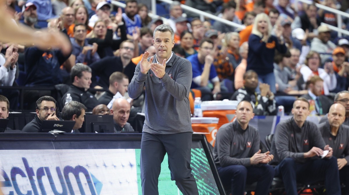 Tony Bennett claps his hands from the sideline during the Virginia men's basketball game against Clemson in the semifinals of the ACC Men's Basketball Tournament at Greensboro Coliseum.