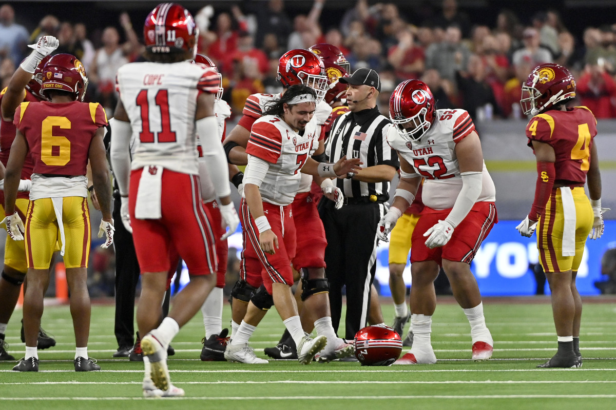 AS VEGAS, NEVADA - DECEMBER 02: Cameron Rising #7 of the Utah Utes picks up his helmet after getting tackled against the USC Trojans during the second half in the Pac-12 Championship at Allegiant Stadium on December 02, 2022 in Las Vegas, Nevada. (Photo by David Becker/Getty Images)