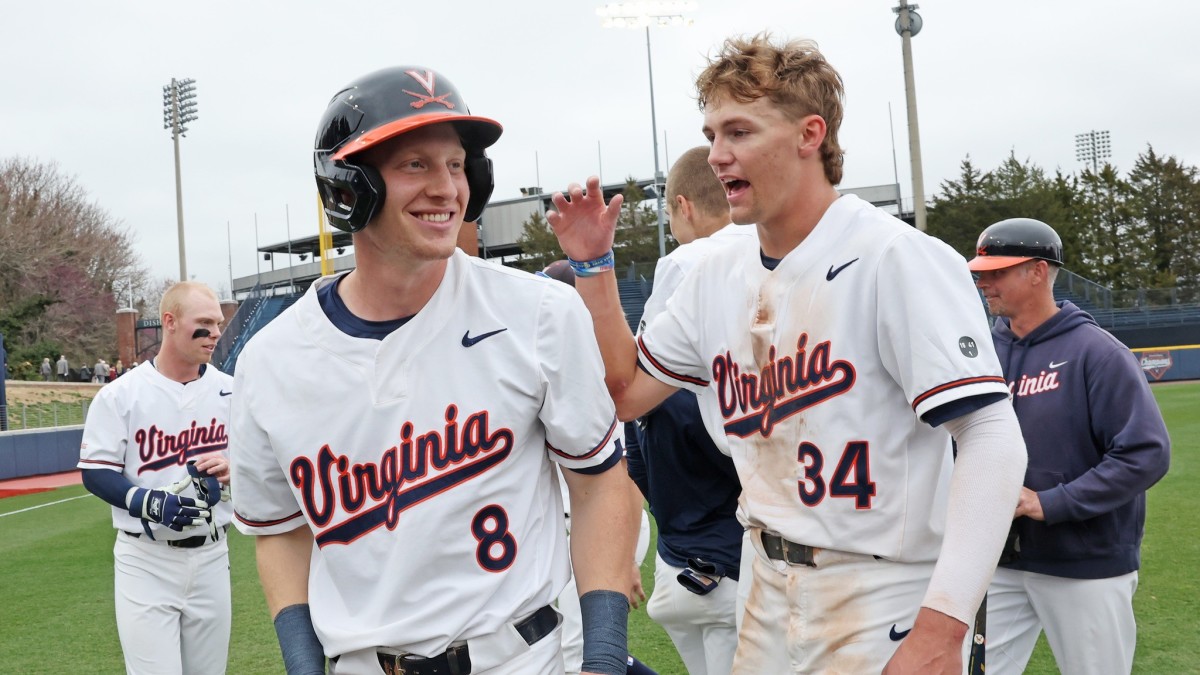 Casey Saucke and Harrison Didawick celebrate after the Virginia baseball game against Florida State at Disharoon Park.