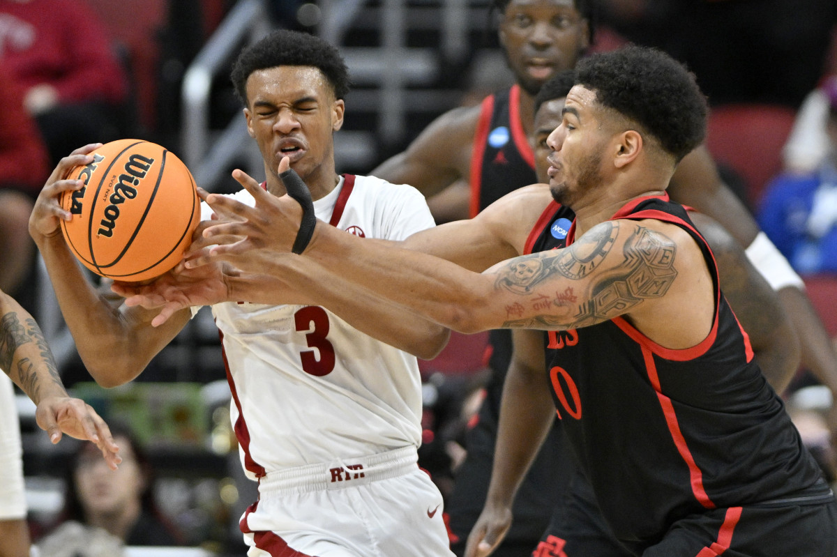 Mar 24, 2023; Louisville, KY, USA; Alabama Crimson Tide guard Rylan Griffen (3) and San Diego State Aztecs guard Matt Bradley (20) fight for a loose ball during the first half of the NCAA tournament round of sixteen at KFC YUM! Center.