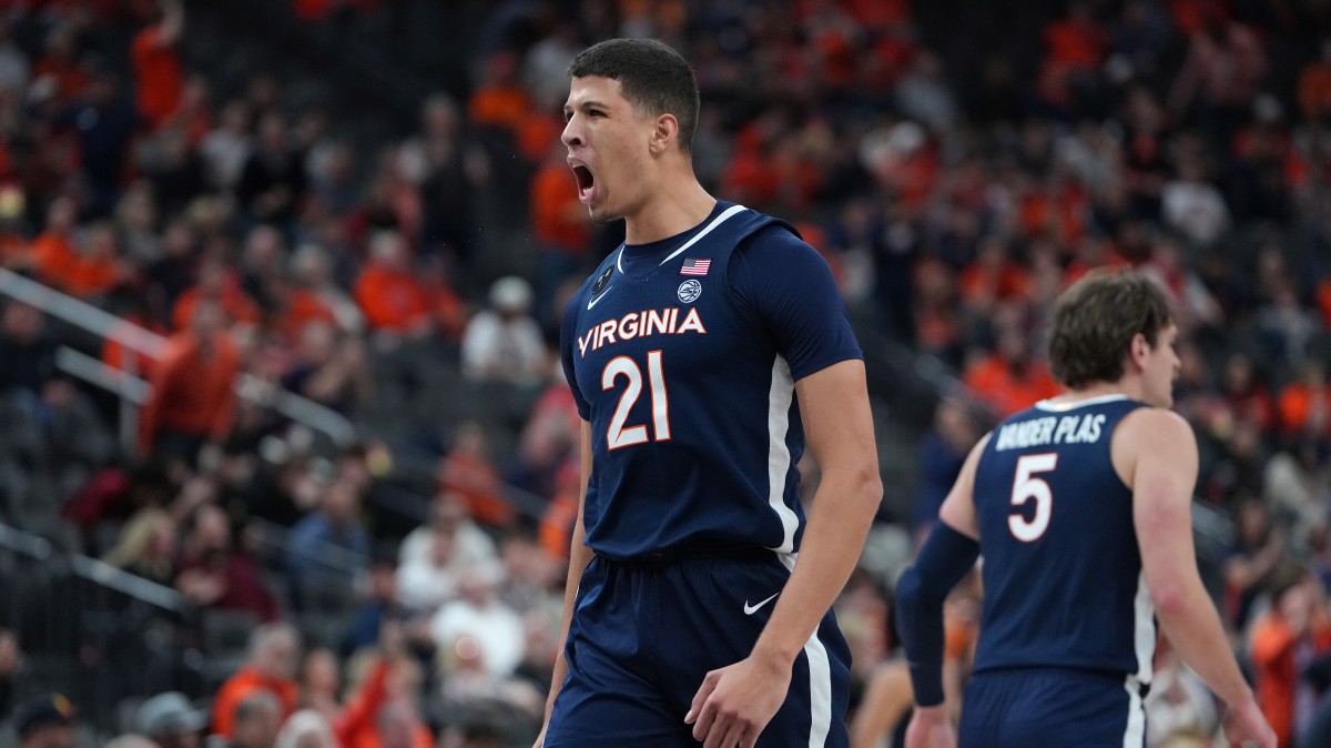 Virginia Cavaliers forward Kadin Shedrick (21) celebrates after making a play against the Baylor Bears during the second half at T-Mobile Arena.