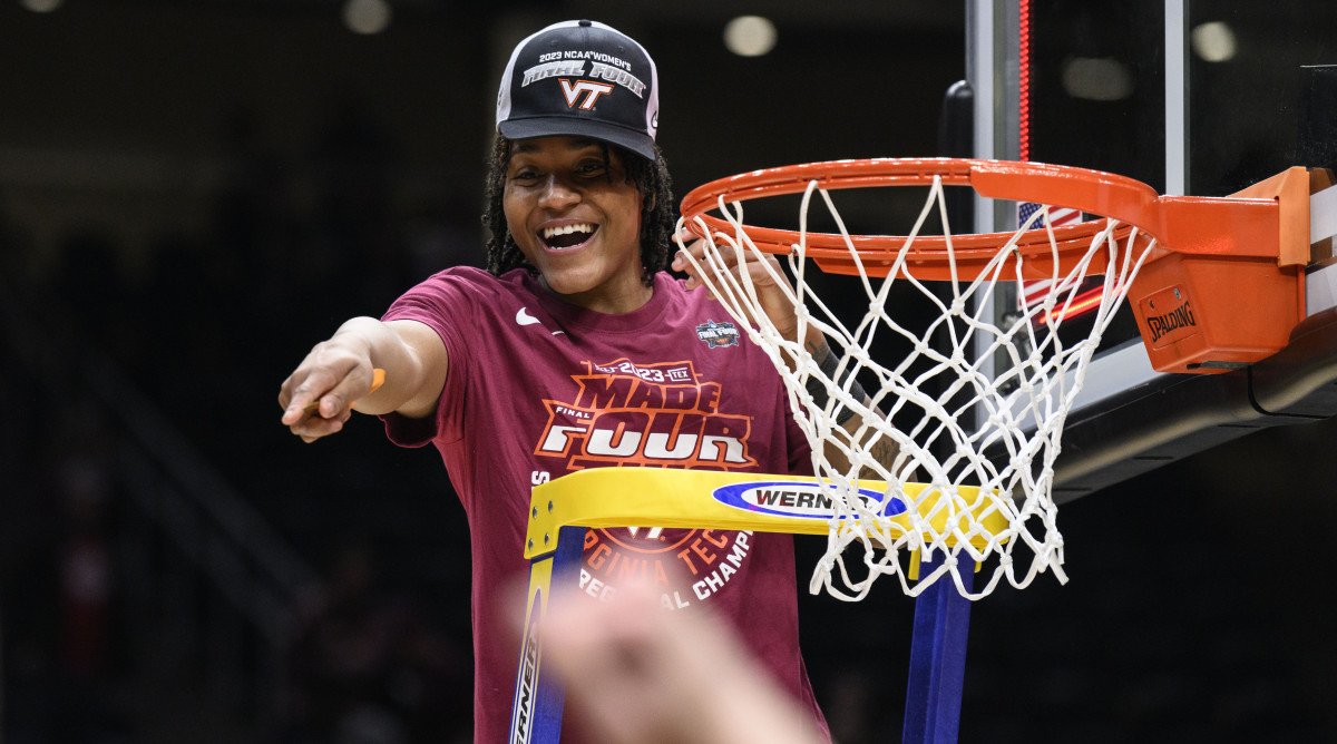 Virginia Tech forward Taylor Soule celebrates as she cuts off a piece of the net after beating Ohio State in the Elite Eight.