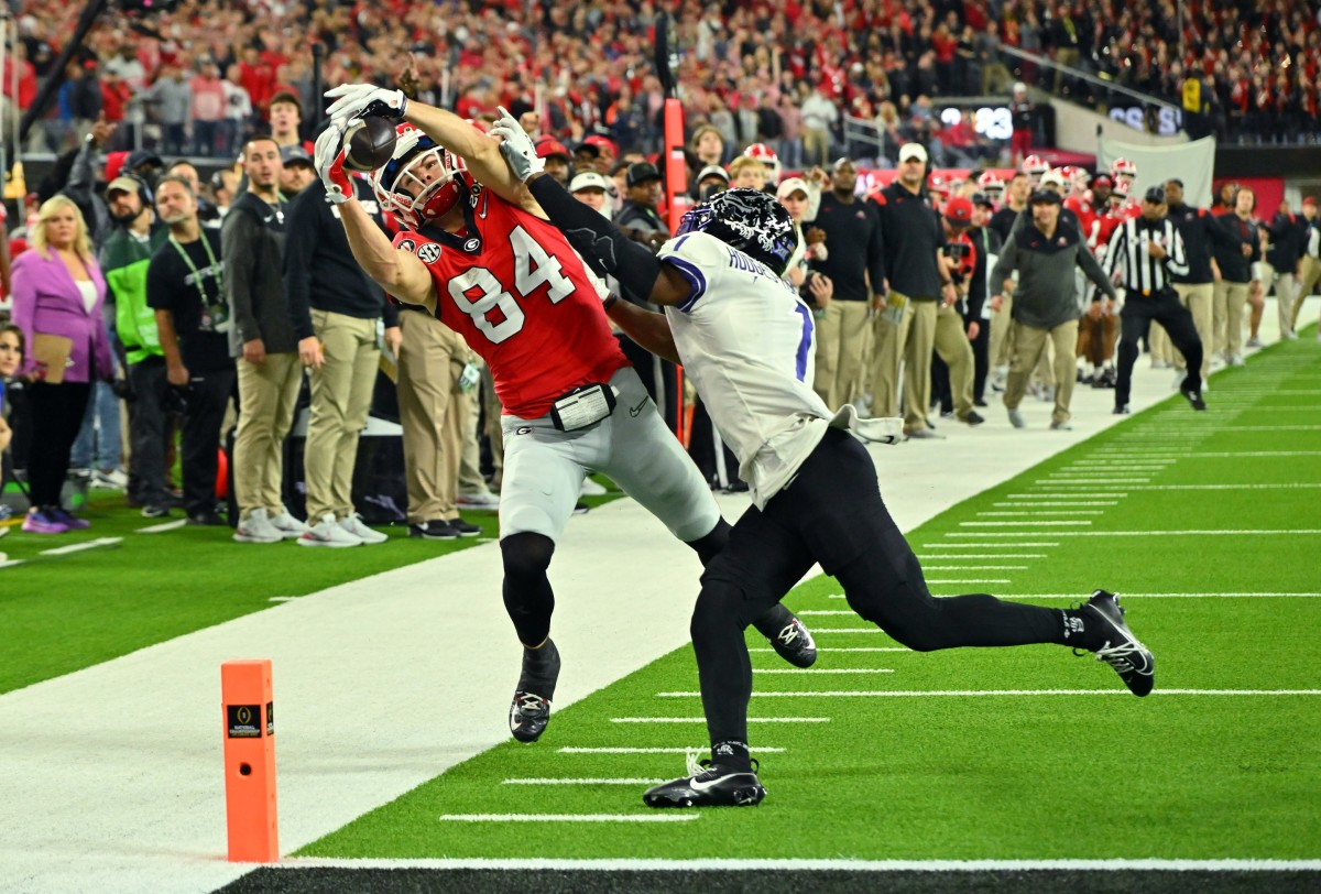 Jan 9, 2023; Inglewood, CA, USA; Georgia Bulldogs wide receiver Ladd McConkey (84) cannot catch a pass against TCU Horned Frogs cornerback Tre'Vius Hodges-Tomlinson (1) during the first half in the CFP national championship game at SoFi Stadium. Mandatory Credit: Jayne Kamin-Oncea-USA TODAY Sports