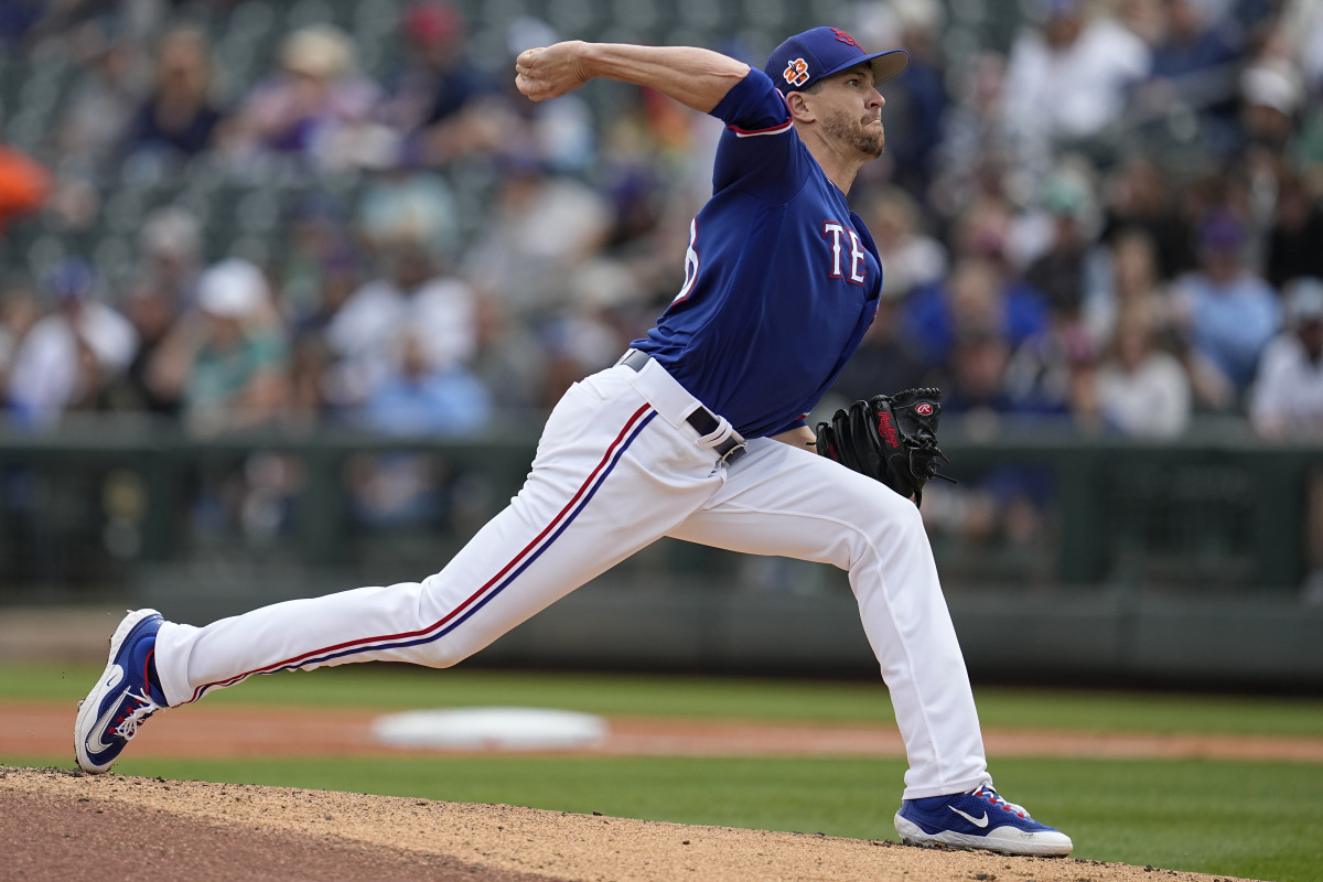 Texas Rangers starting pitcher Jacob deGrom delivers during the first inning of a spring training baseball game against the Seattle Mariners