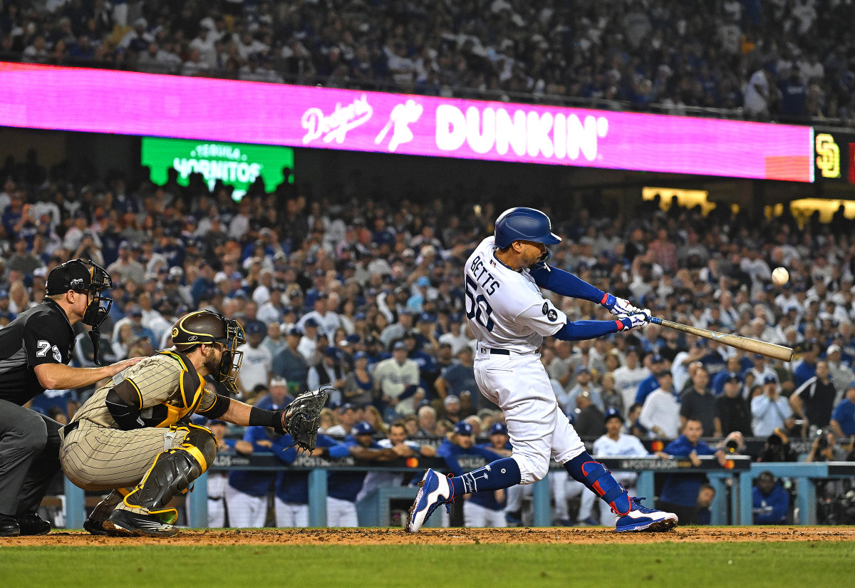 Mookie Betts connects with a pitch during a game for the Dodgers.