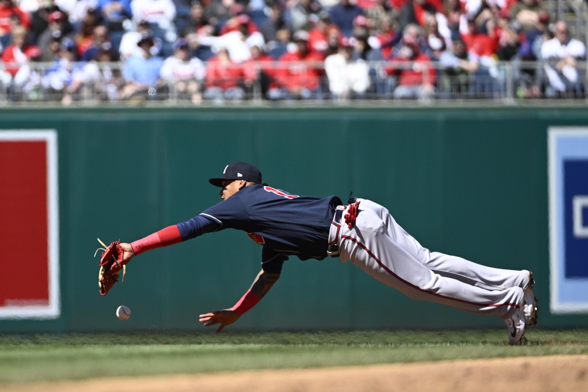 Mar 30, 2023; Washington, District of Columbia, USA; Atlanta Braves second baseman Orlando Arcia (11) is unable to catch a fly ball hit by Washington Nationals first baseman Dominic Smith (22) during the second inning at Nationals Park. Mandatory Credit: Brad Mills-USA TODAY Sports