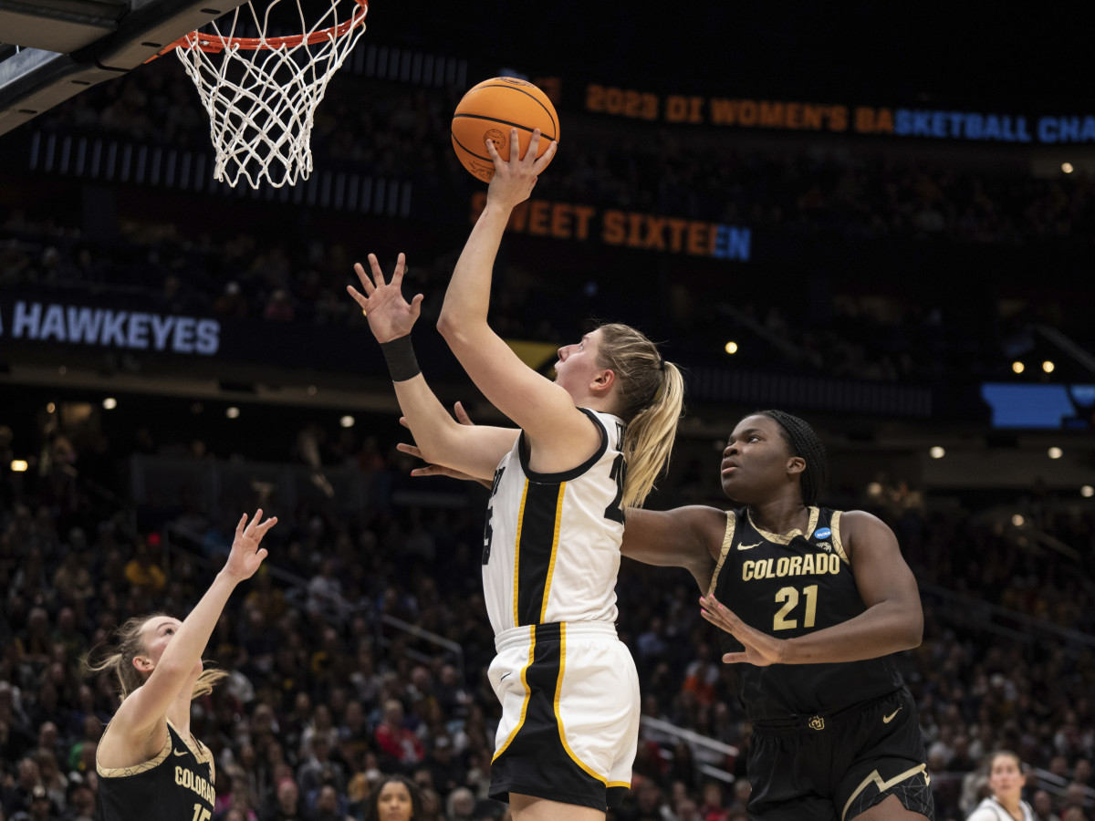 Iowa forward Monika Czinano shoots over Colorado guard Kindyll Wetta and center Aaronette Vonleh during the Sweet 16 of the NCAA women’s tournament.