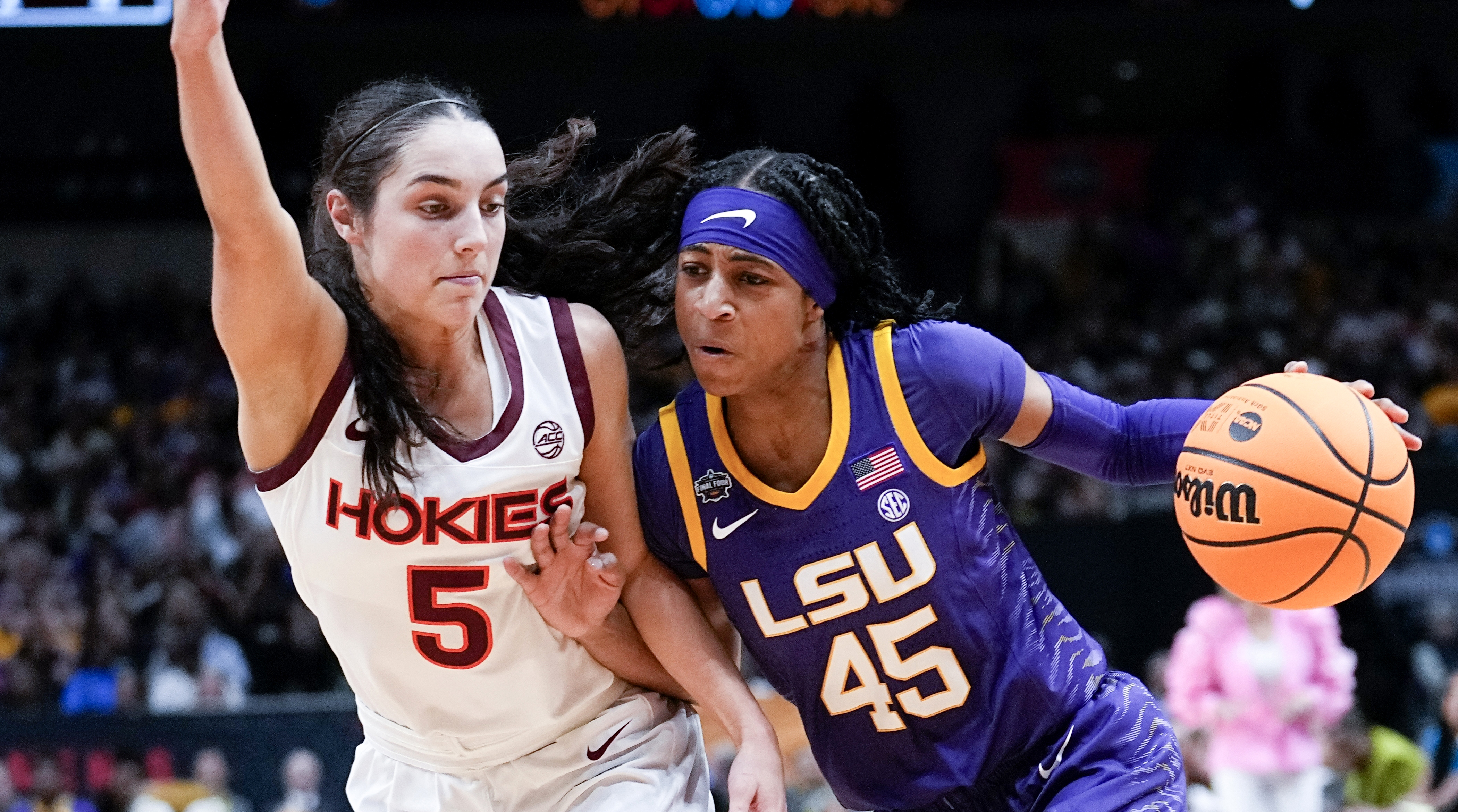 LSU’s Alexis Morris drives past Virginia Tech’s Georgia Amoore during the first half of an NCAA Women’s Final Four semifinals.