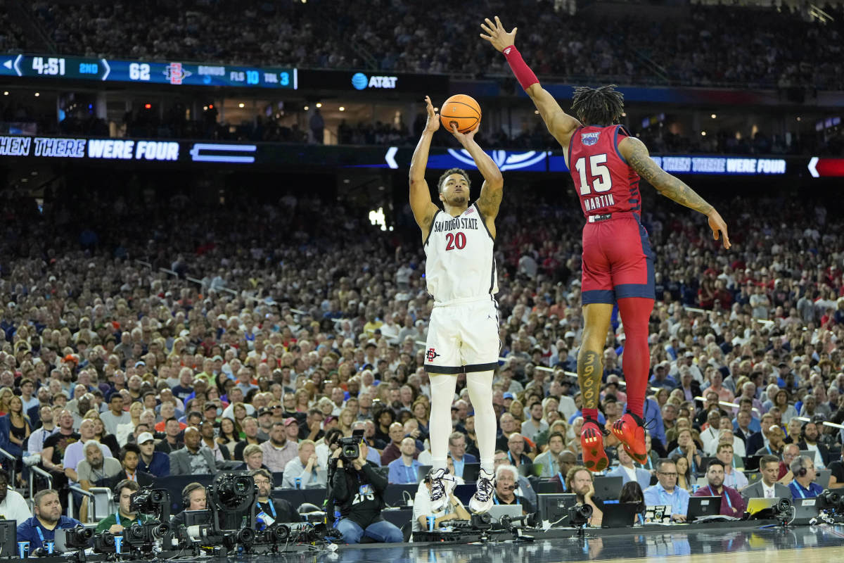 San Diego State Aztecs guard Matt Bradley shoots a jump shot with a FAU defender reaching up to try and guard it