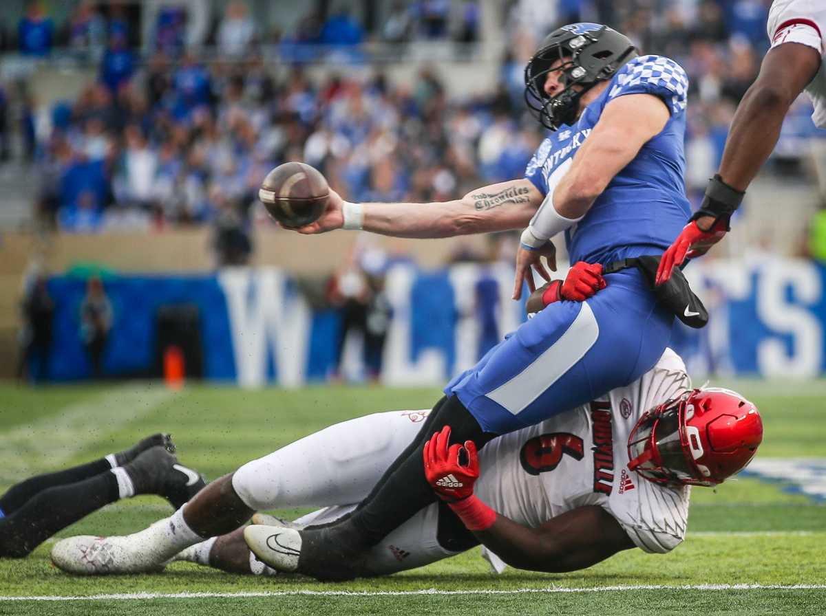 Louisville defensive lineman YaYa Diaby wraps ups Kentucky quarterback Will Levis in the second quarter of the Governor's Cup game. Nov. 26, 2022 Louisville Vs Kentucky 2022 Football