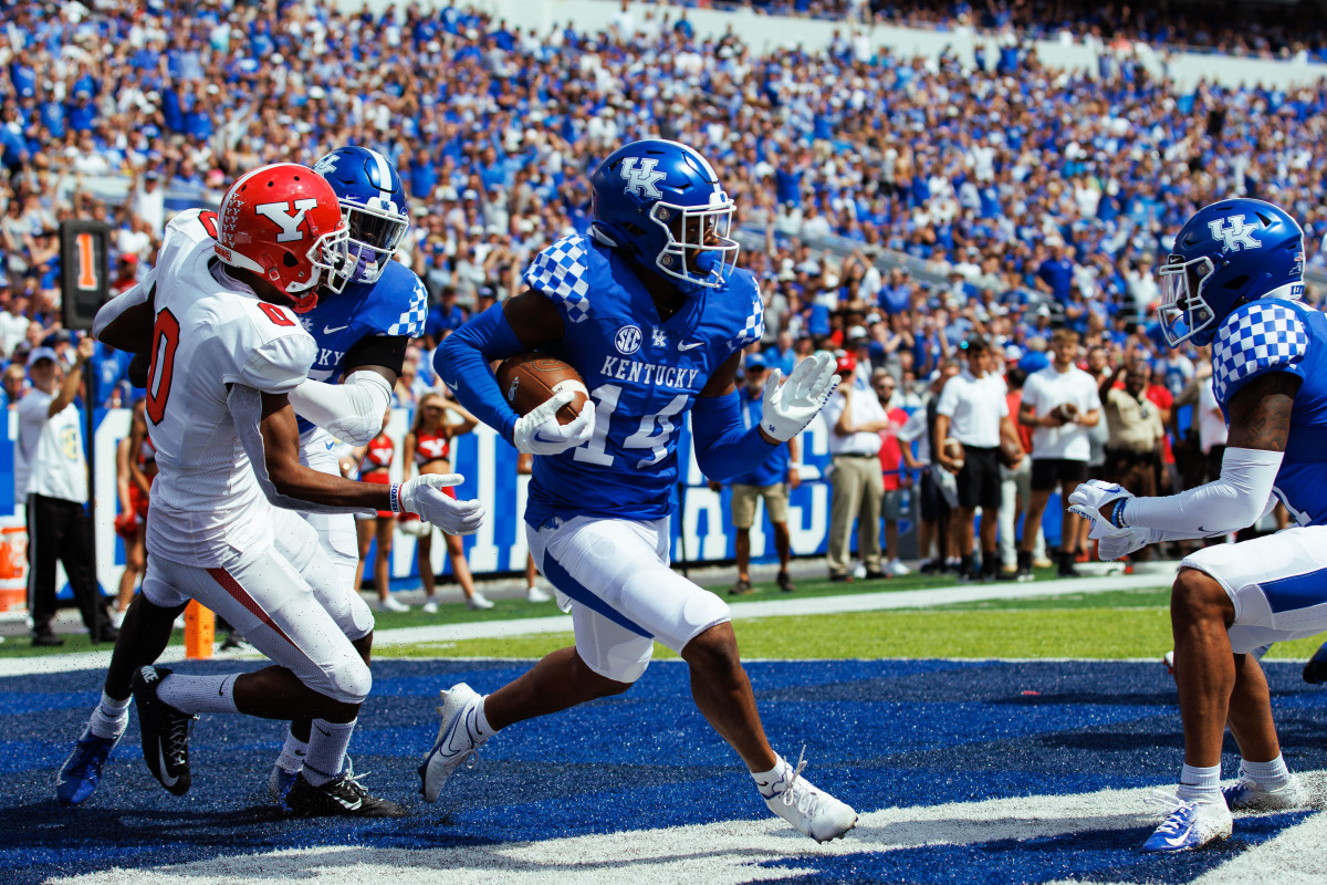 Sep 17, 2022; Lexington, Kentucky, USA; Kentucky Wildcats defensive back Carrington Valentine (14) intercepts a pass in the Youngstown State Penguins end zone during the third quarter at Kroger Field.