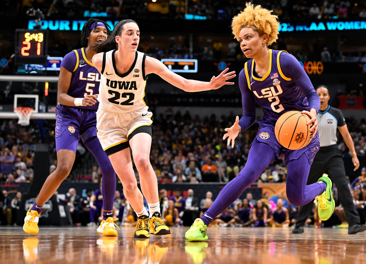 LSU’s Jasmine Carson dribbles past Iowa’s Caitlin Clark in the NCAA women’s national title game.