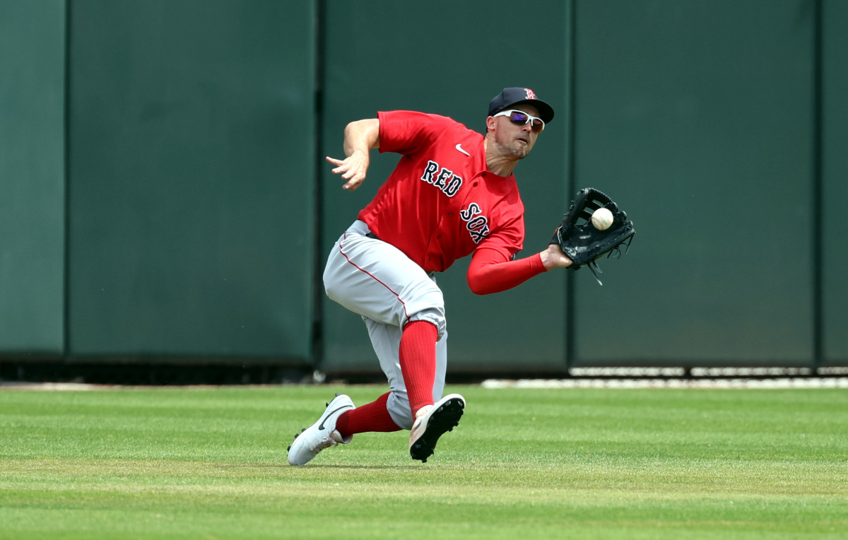 Boston Red Sox center fielder Adam Duvall catches a fly ball against Atlanta. (2023)