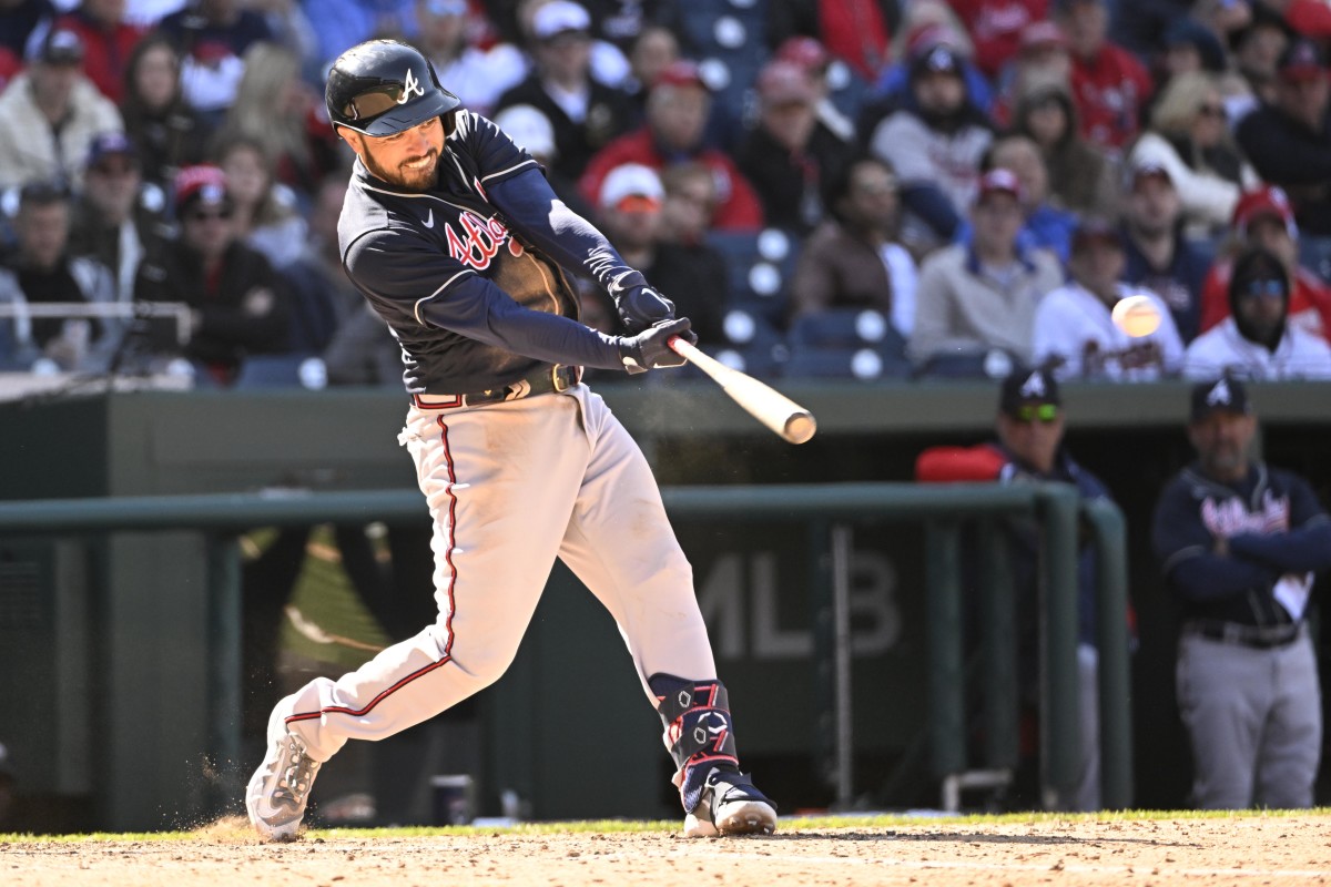 Mar 30, 2023; Washington, District of Columbia, USA; Atlanta Braves catcher Travis d'Arnaud (16) hits a two RBI double against the Washington Nationals during the ninth inning at Nationals Park.
