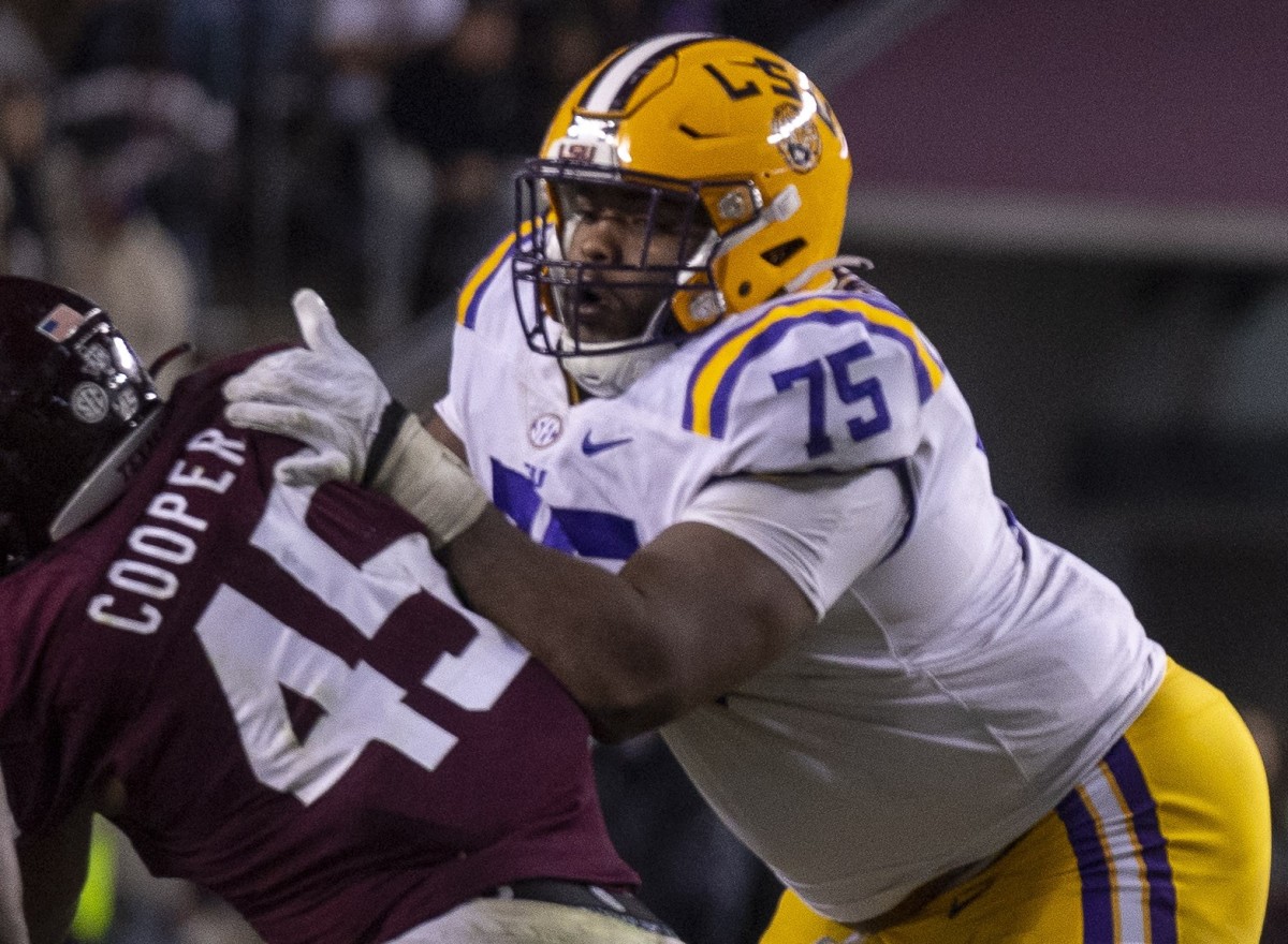 LSU Tigers offensive lineman Anthony Bradford (75) and offensive lineman Charles Turner (69) and quarterback Jayden Daniels (5) in action during the game between the Texas A&M Aggies and the LSU Tigers at Kyle Field.