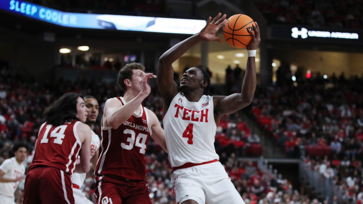 Texas Tech Red Raiders forward Robert Jennings (4) shoots over Oklahoma Sooners forward Jacob Groves (34) in the first half at United Supermarkets Arena.