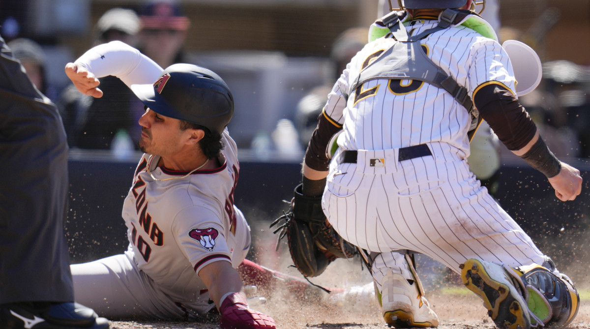 Diamondbacks' Josh Rojas steals home as Padres catcher Austin Nola is late with the tag.