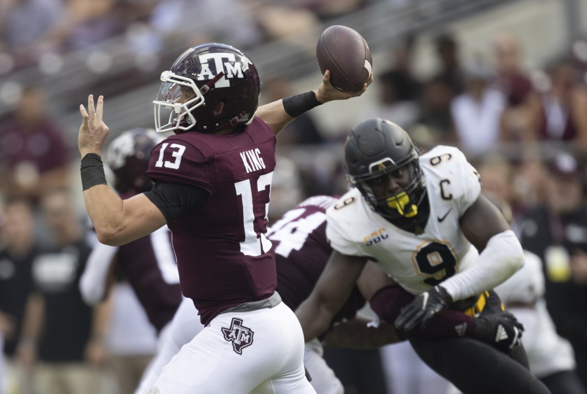 Sep 10, 2022; College Station, Texas, USA; Texas A&M Aggies quarterback Haynes King (13) passes against the rush of Appalachian State Mountaineers linebacker Nick Hampton (9) in the second quarter at Kyle Field. Mandatory Credit: Thomas Shea-USA TODAY Sports