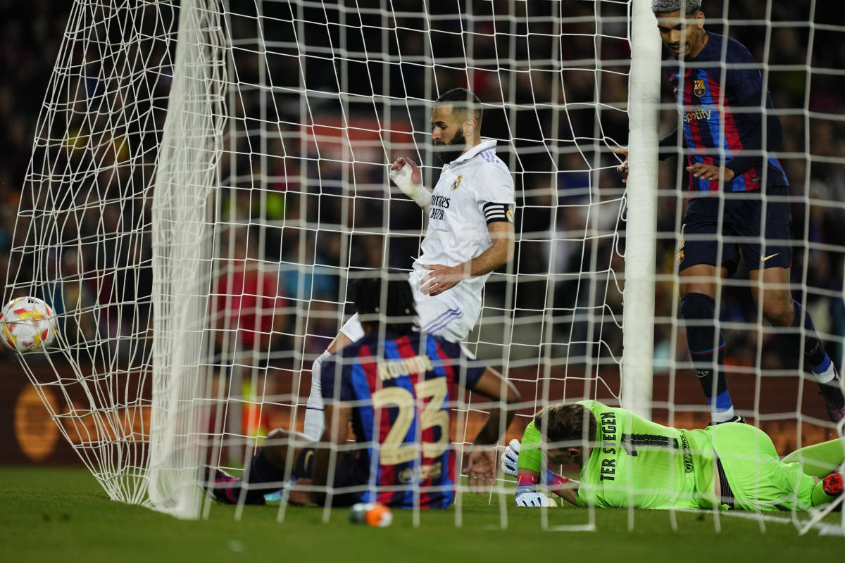 Real Madrid striker Karim Benzema pictured (center) kicking the ball into the back of the Barcelona net during their Copa del Rey semi-final second leg in April 2023
