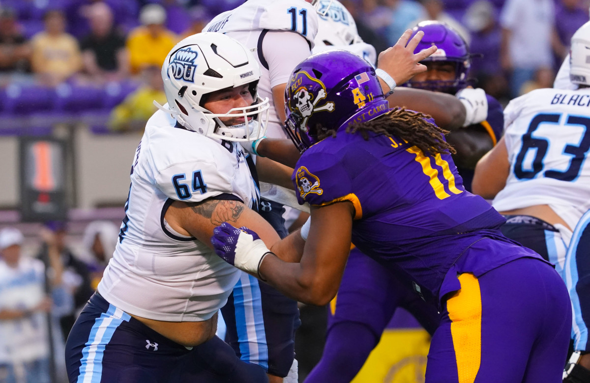 Sep 10, 2022; Greenville, North Carolina, USA; Old Dominion Monarchs offensive lineman Nick Saldiveri (64) blocks East Carolina Pirates linebacker Jeremy Lewis (11) during the first half at Dowdy-Ficklen Stadium. Mandatory Credit: James Guillory-USA TODAY Sports