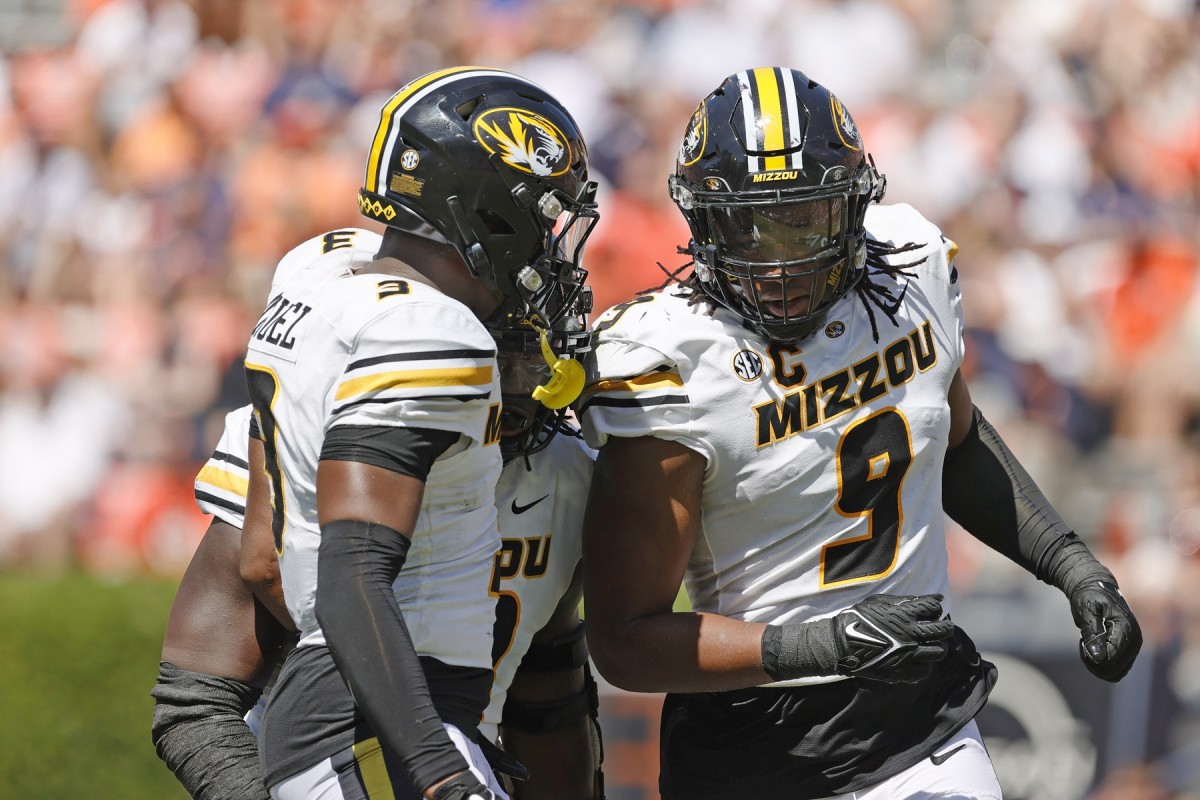 Sep 24, 2022; Auburn, Alabama, USA; Missouri Tigers defensive lineman Isaiah McGuire (9) celebrates with defensive back Martez Manuel (3) after sacking Auburn Tigers quarterback Robby Ashford (9) during the second quarter at Jordan-Hare Stadium. Mandatory Credit: John Reed-USA TODAY Sports