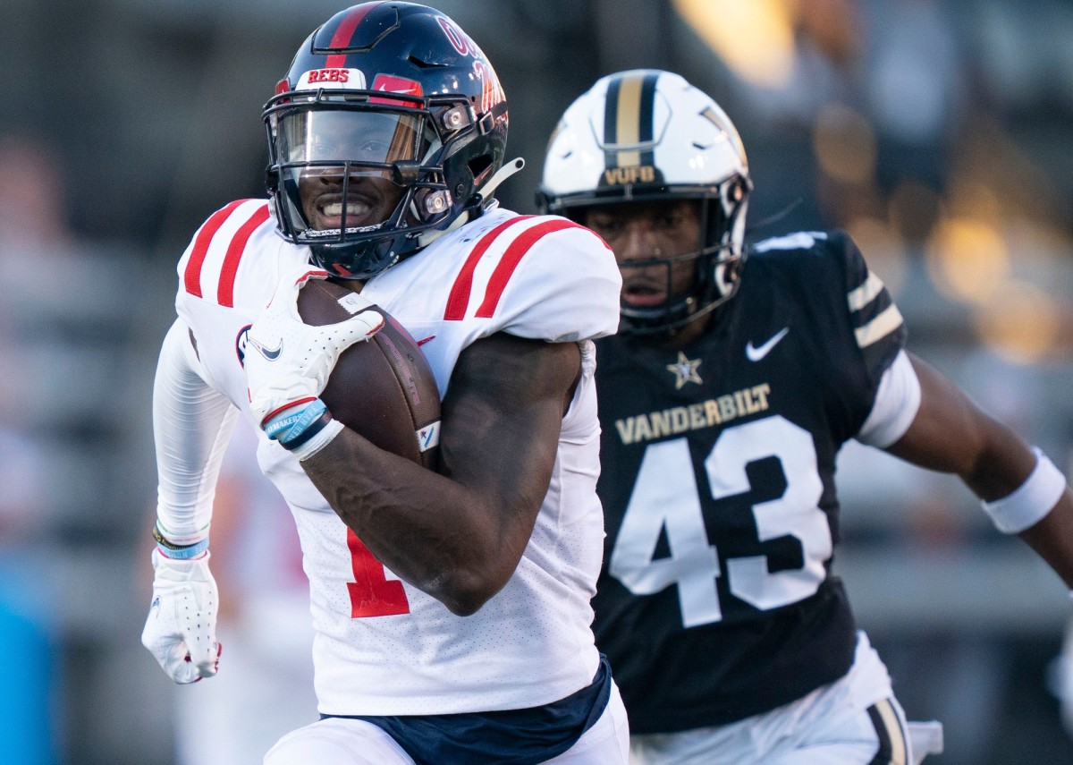 Mississippi wide receiver Jonathan Mingo (1) races up the field with a 71 yard touchdown pass past Vanderbilt linebacker De'Rickey Wright (43) during the third quarter at FirstBank Stadium Saturday, Oct. 8, 2022, in Nashville, Tenn. Nas Vanderbilt Miss 053