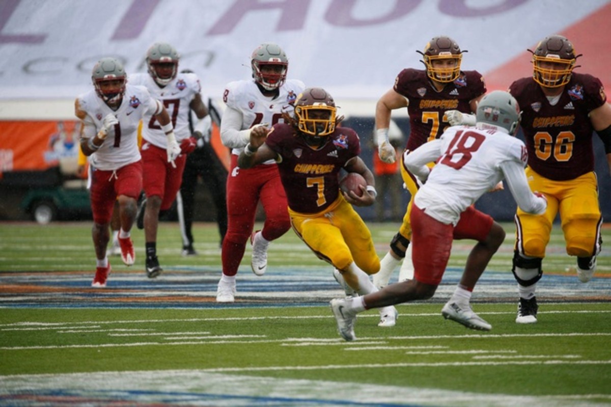 Central Michigan sophomore Lew Nichols III is the nation's leading rusher. In this photo he rushes against Washington State University during the 88th Annual Tony the Tiger Sun Bowl at University of Texas El Paso Sun Bowl Stadium on Friday Dec. 31, 2021. Michigan won the game 24-21. Sun Bowl1223
