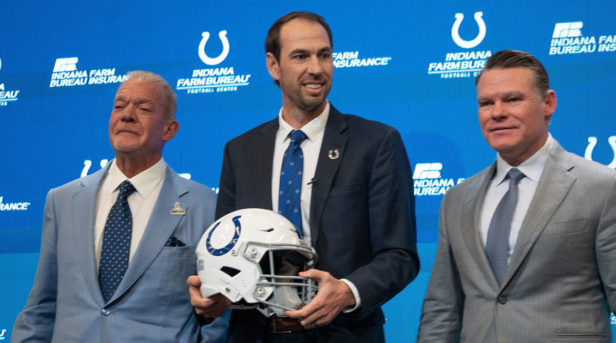 Shane Steichen holds a Colts helmet at his introductory press conference