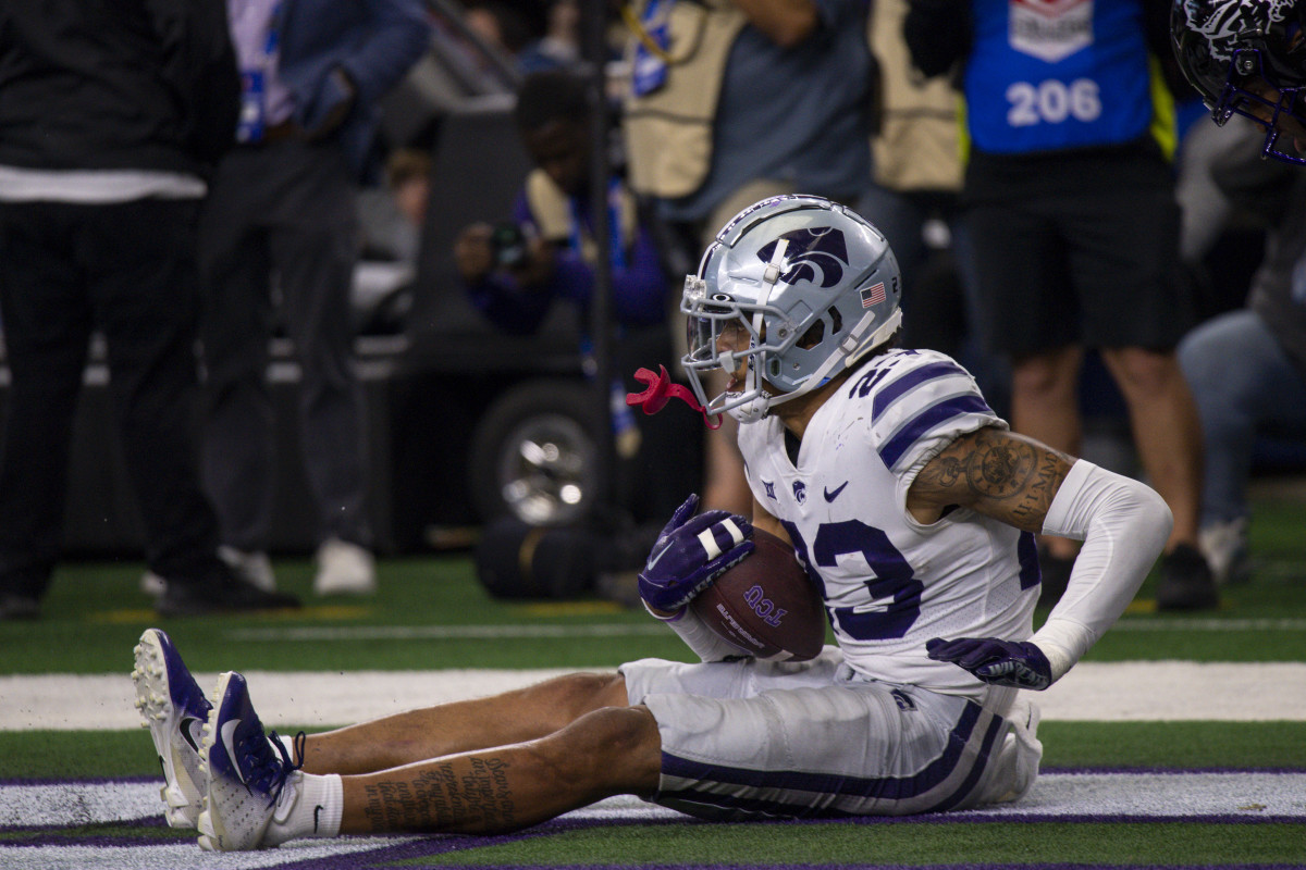 Dec 3, 2022; Arlington, TX, USA; Kansas State Wildcats cornerback Julius Brents (23) falls back into the end zone after incepting a pass thrown by TCU Horned Frogs quarterback Max Duggan (15) during the second half at AT&T Stadium.
